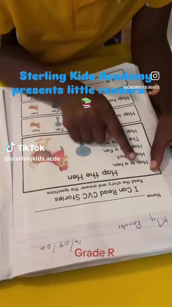 A Grade R learner points to a reading worksheet, from the academy’s original clip.